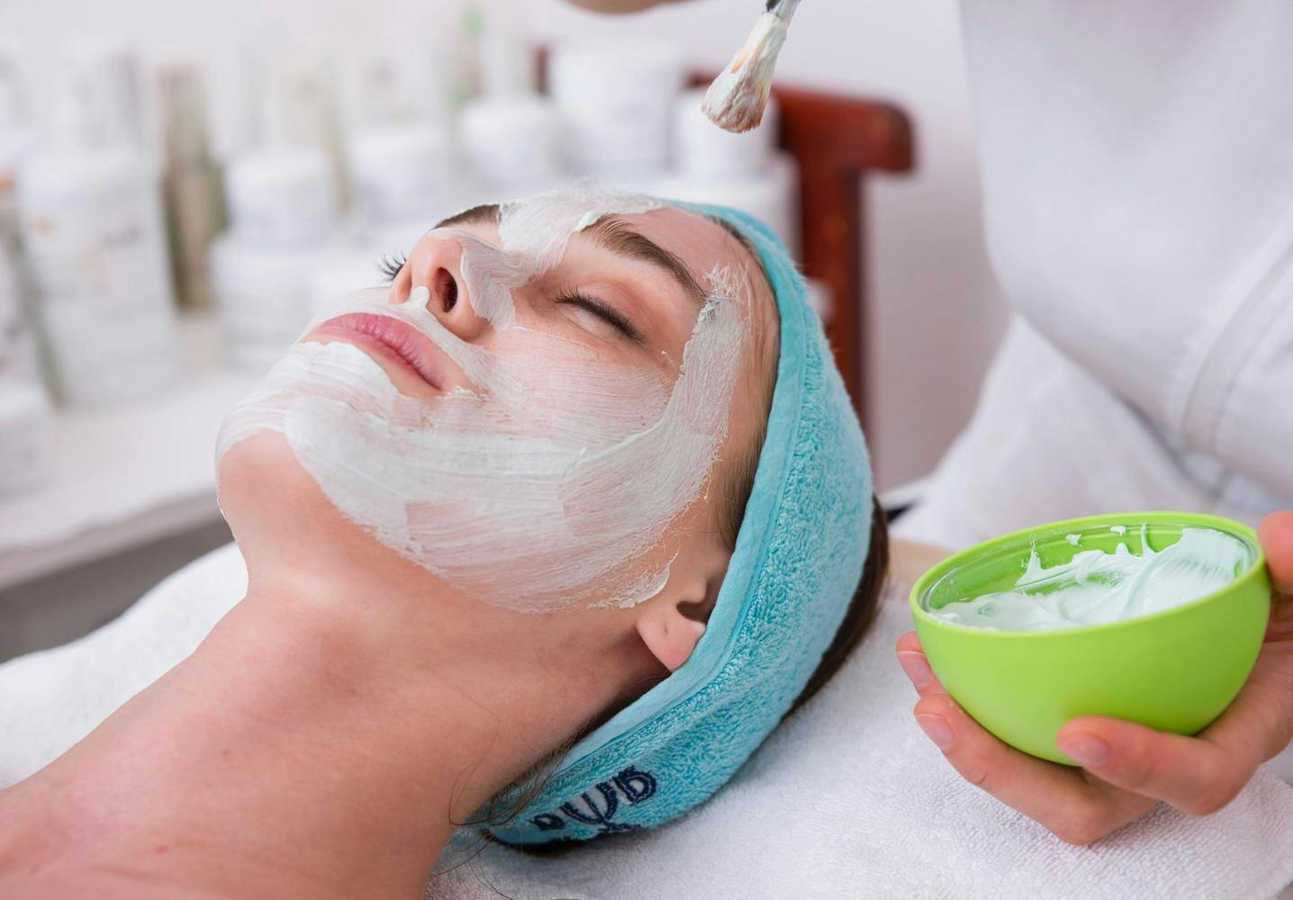 A woman in a spa for a facial 
