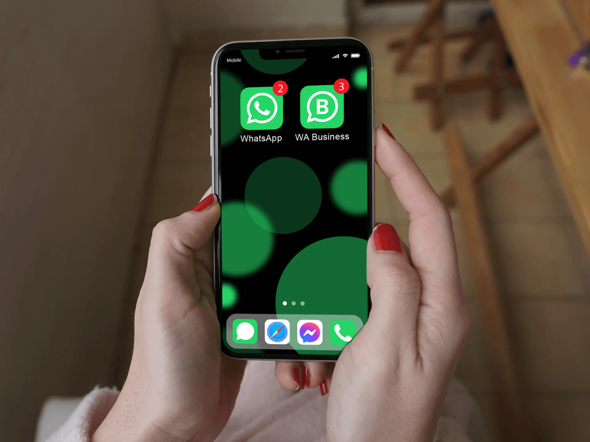 hands holding a phone with WhatsApp and WhatsApp Business installed on it